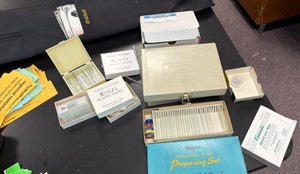 lot of microscope, slides, preparing sets, plastic slides, and carrying cases