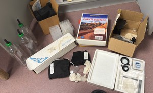 Earth science transparencies, books, fluoride, transfer bottles, bags of prisms