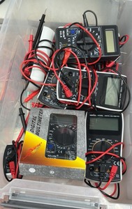 totes of digital multimeter, rocks, trucks and miscellaneous