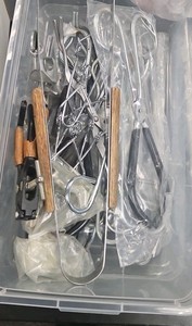 tote of tweezers and crucible tongs