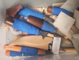 plastic container of wood carving supplies