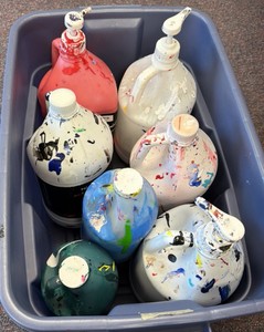 tote of partially full acrylic paint