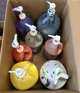 tote of almost full acrylic paints