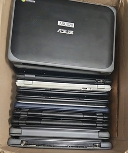 box of broken Chromebooks