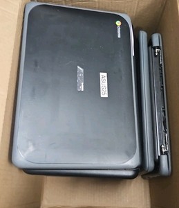 box of broken Chromebooks