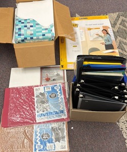 lot of paper, Post It notes, paper folders and construction paper