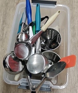 bucket of kitchen utensils