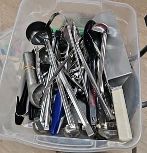 Bucket of kitchen utensils