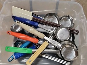 bucket of kitchen utensils