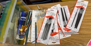 tote of paint brushes, mostly new