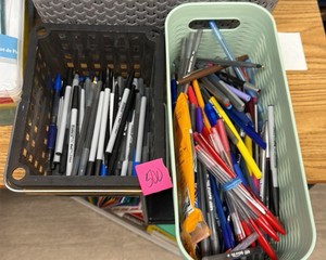 two bins of pens