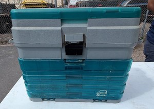 Plano tackle box filled with lures, sinkers, bobbers etc