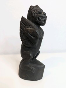 Vintage, hand-carved wooden figurine reminiscent of Balinese or Southeast Asian mythology