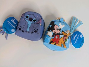 NIB CandyRific Disney Mini Backpacks featuring characters like Mickey Mouse and Stitch on a small, zippered pouch