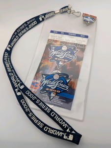 2000 World Series collectible set featuring a New York Yankees vs. New York Mets ticket stub, a branded lanyard, and an I Was There pin