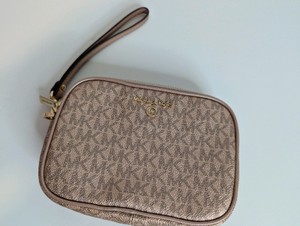Michael Kors metallic rose gold monogram wristlet, Like New