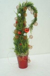 whimsical 24 artificial Christmas Tree often referred to as a Grinch Tree