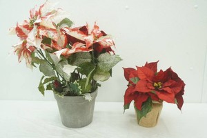 2 artificial poinsettia arrangements