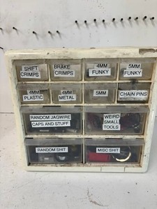 Small Parts Organizer Cabinet With Assorted Bike Parts