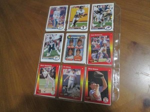 Double Sided Page of Mixed Lot Sports Cards in Plastic Pages