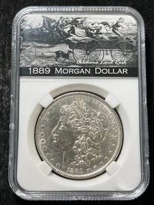 1889 US MORGAN SILVER DOLLAR SLABBED