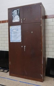 TALL WOODEN CUPBOARD
