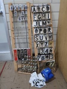 3 RACKS PLUS LOTS OF SELF REFLECTING LETTERS AND NUMBERS