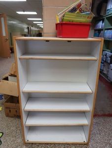 TALL WOODEN DRESSER & BOOKS