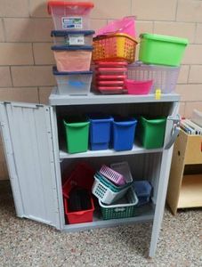 GRAY PLASTIC CABINET WITH PLASTIC TOTES
