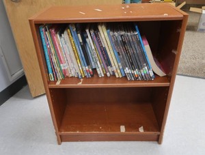 VINTAGE SHELF FILLED WITH BOOKS