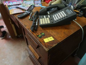 WOODEN DESK WITH MYSTERY ITEMS ON TOP TAKE WHAT YOU WANT