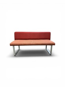 Esto soft seating bench features a unique two-tone design with a patterned yellow back and an orange seat Retails for $1200