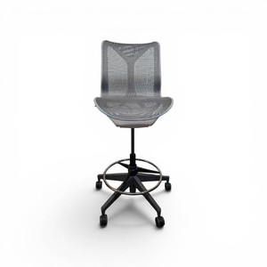Herman Miller Cosm Drafting stool featuring a sleek, armless design with a breathable mesh back and seat