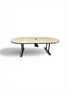 Special-T Olympus conference table features a racetrack top and black T-legs