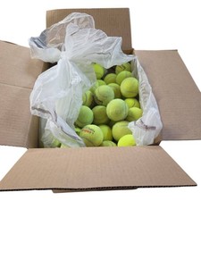 Box full of tennis balls