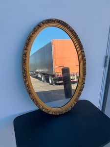 Oval mirror with gold frame