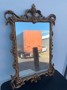Ornate gold framed mirror