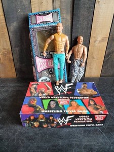 Collectible Jesse Ventura WWF action figures one with box and WWF Trivia Game