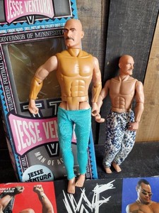 Collectible Jesse Ventura WWF action figures one with box and WWF Trivia Game