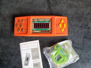 Collectible Tandy Football Game with instructions and vintage activation tennis game
