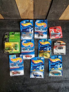Lot of hotwheels and one john deere still in packages