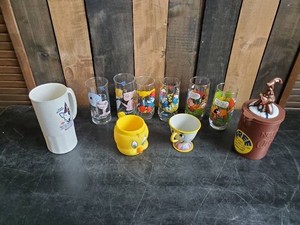 Lot of Disney and other drinking glasses of various styles