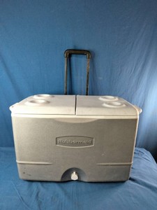 Rubbermaid 50-Quart Durachill Wheeled Cooler featuring a split lid and built-in cup holders.