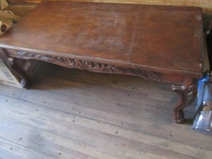 Carved wood coffee table