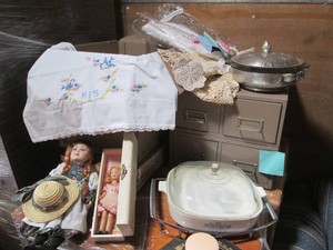 Porcelain doll, Corningware, doilie...