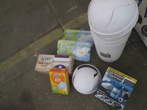 Lot of cleaners and 3 trash bins...