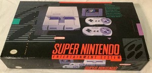 Super Ninetendo Entertainment System (SNES) - Console, Two Controllers and Super Mario Would Game