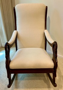 Vintage high back Cherry Wood swan-neck rocking chair, cream colored upholstered