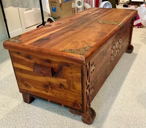 Cedar wood chest with brass corner hardware and ornate details