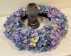 Group of purple decorations, wreath, candle